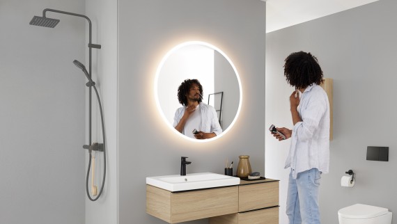 Geberit bathroom with Geberit Option illuminated round mirror