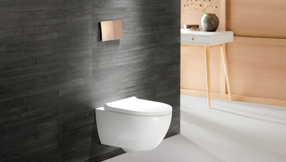 Gold taps and actuator plates combined with dark colours Gold taps and actuator plates combined with dark colours