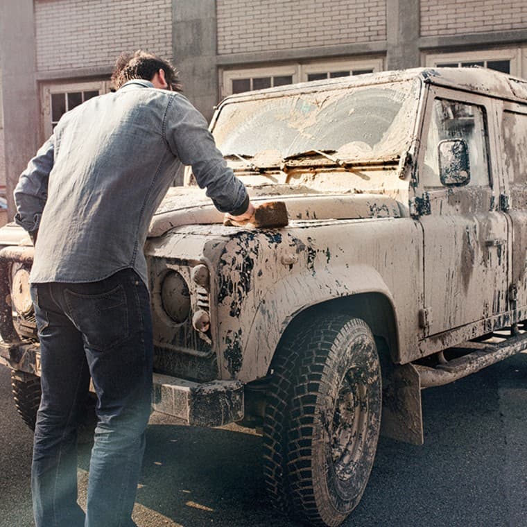 Man cleaning a car Man cleaning a car